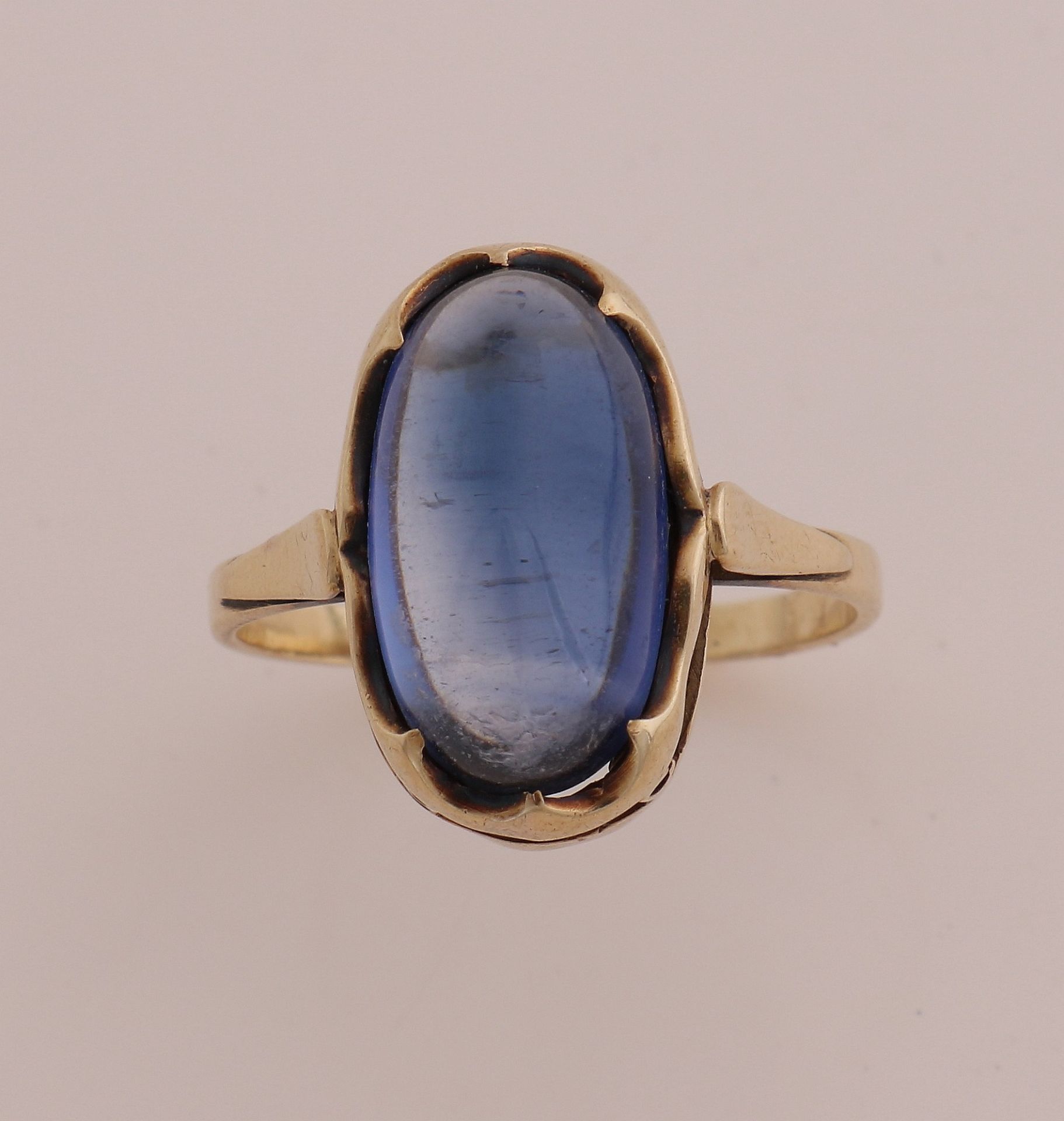 Gold ring with blue stone