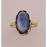 Gold ring with blue stone