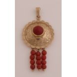 Gold pendant with red coral