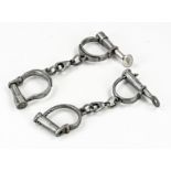 Two antique iron handcuffs