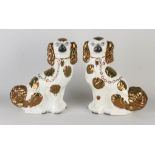Two antique English Staffordshire dogs