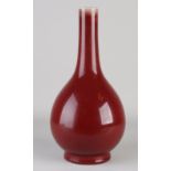 Sang de Boeuf pipe vase, H 38 cm.