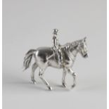 Silver horse with rider