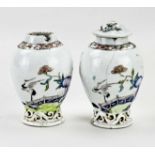 Two 18th century Chinese lidded vases, H 11 - 12.5 cm.