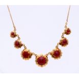 Gold choker with garnet