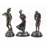 Three bronze figures