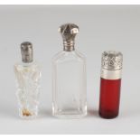Three perfume bottles with silver