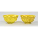 Two Chinese bowls with relief Ø 15.5 cm.