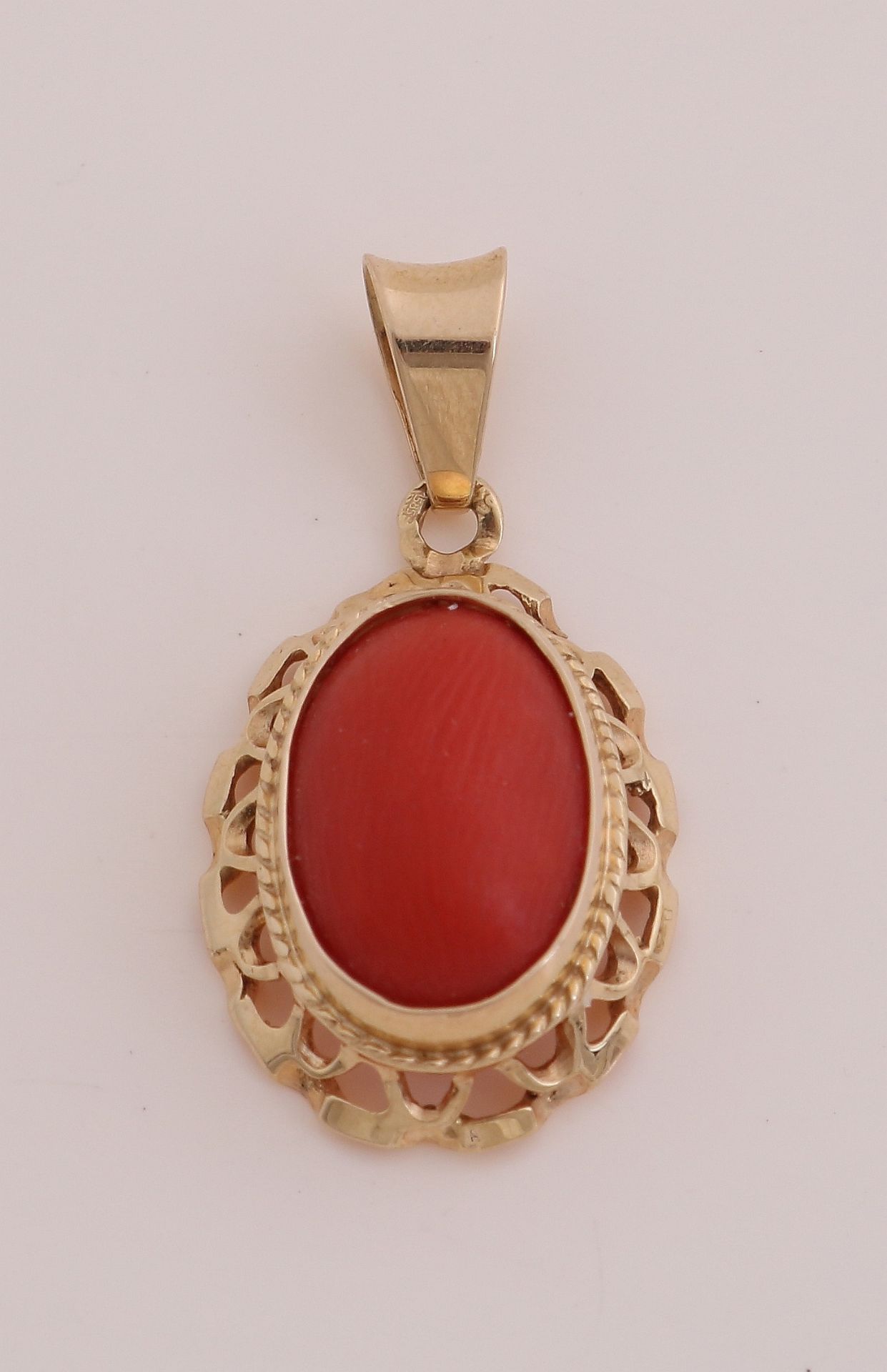 Gold pendant with red coral