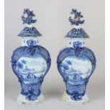 Two 18th century Delft vases with lids, H 36 cm.