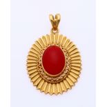 Gold pendant with red coral