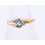 Gold ring with blue topaz