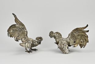 Two silver roosters