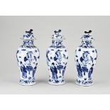 Three 18th - 19th century Chinese lidded vases, H 23 cm.