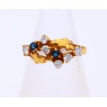 Gold ring with sapphire and diamond