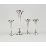 Four silver vases