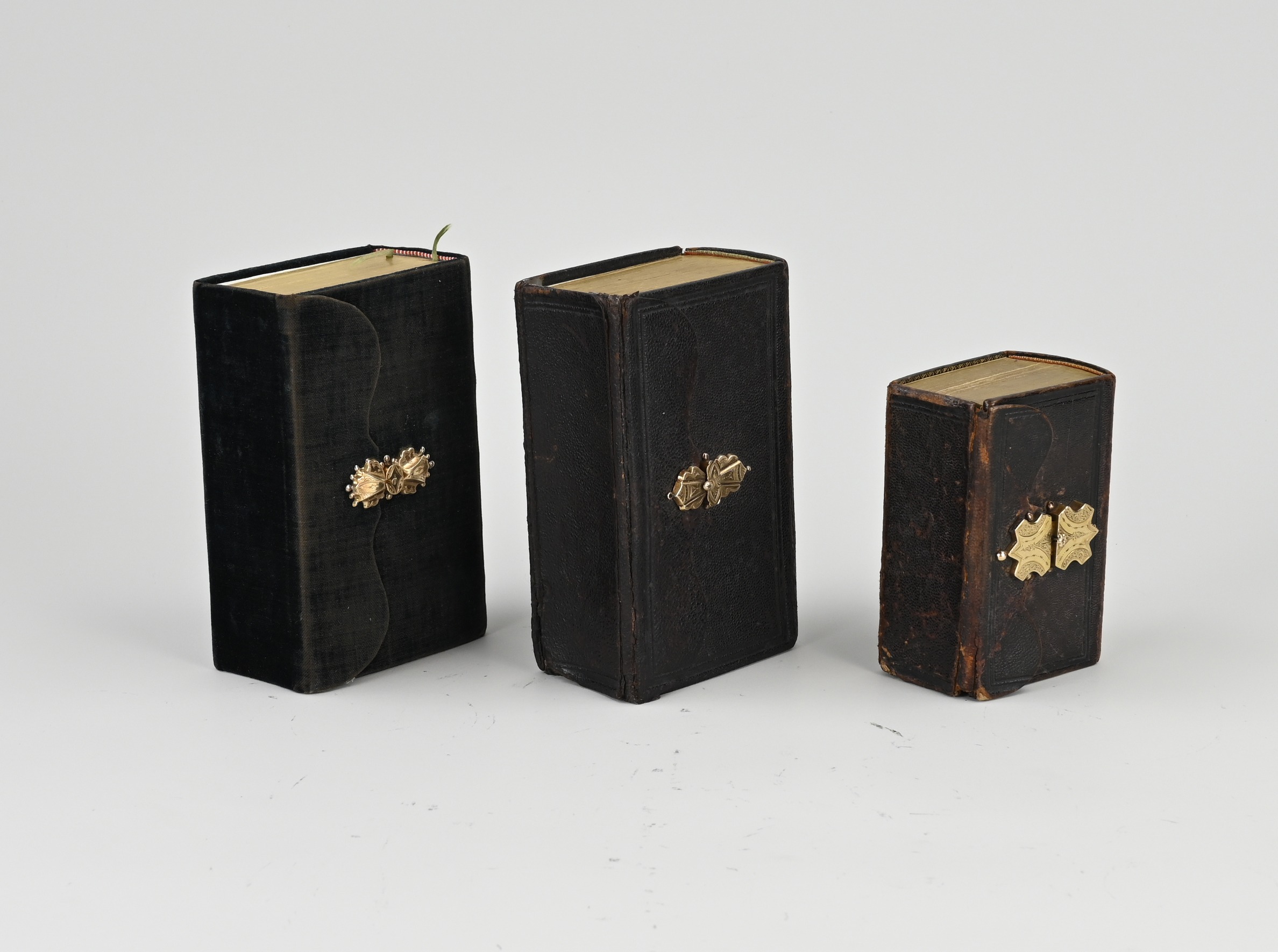 3 Bibles with golden lock