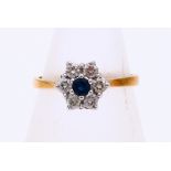 Gold rosette ring with sapphire and diamond