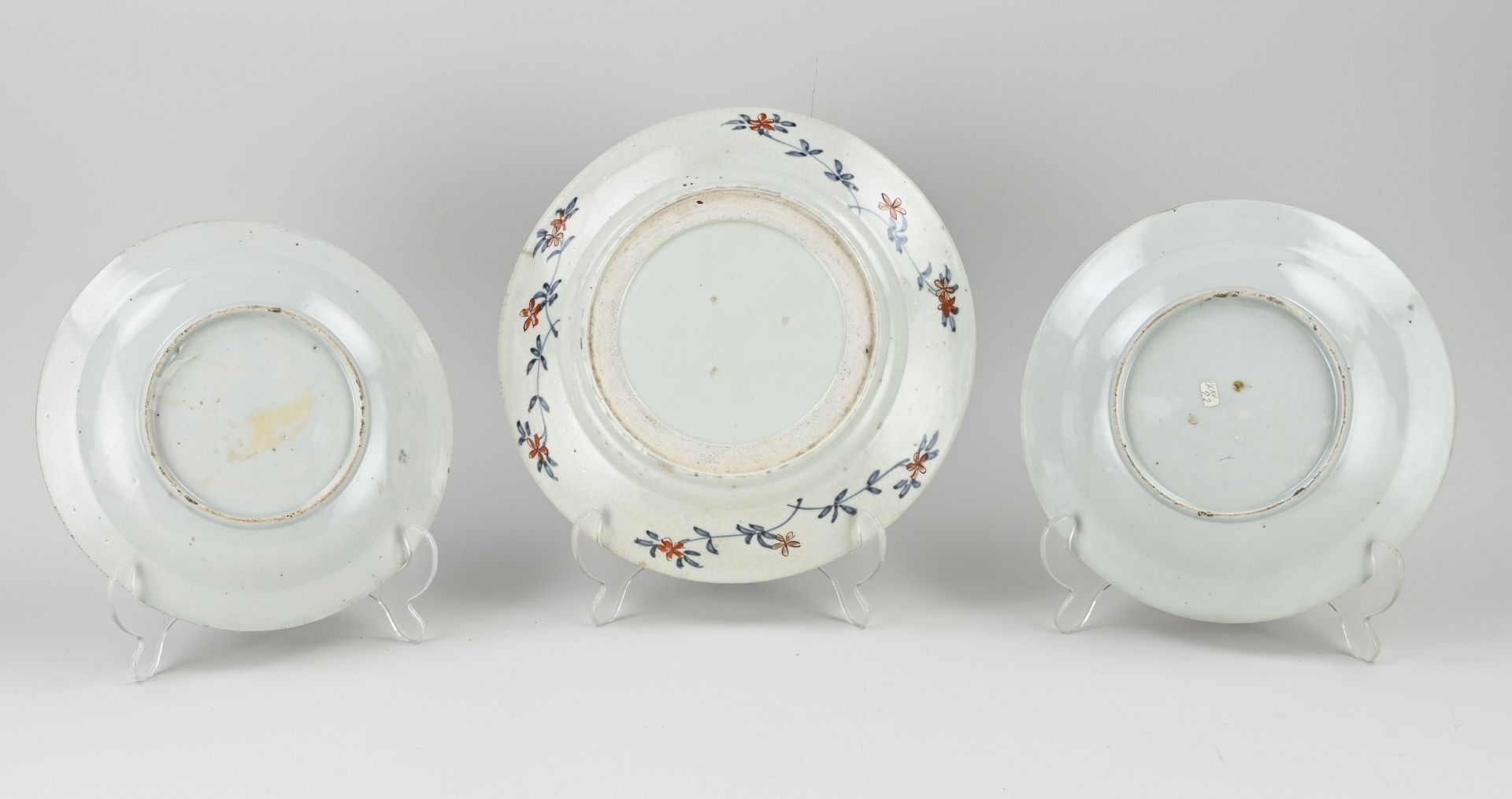 Three 18th century Japanese Imari plates Ø 20 - Ø 24 cm. - Image 2 of 2