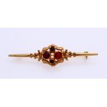 Gold brooch with garnet