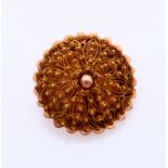 Gold regional brooch