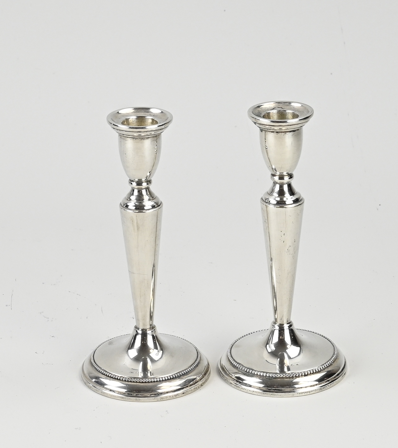 Two silver candlesticks