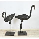 Two bronze flamingos