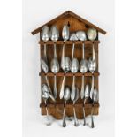 Antique spoon rack with pewter spoons, 1900