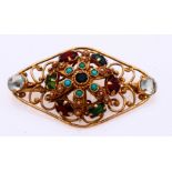 Gold brooch with colored stones