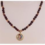 Garnet necklace with portrait pendant