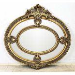 Large oval mirror, H 135 x W 142 cm.