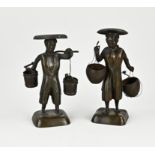 Two Japanese or Chinese figures bearers