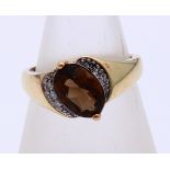 Gold ring with smoky quartz and diamond