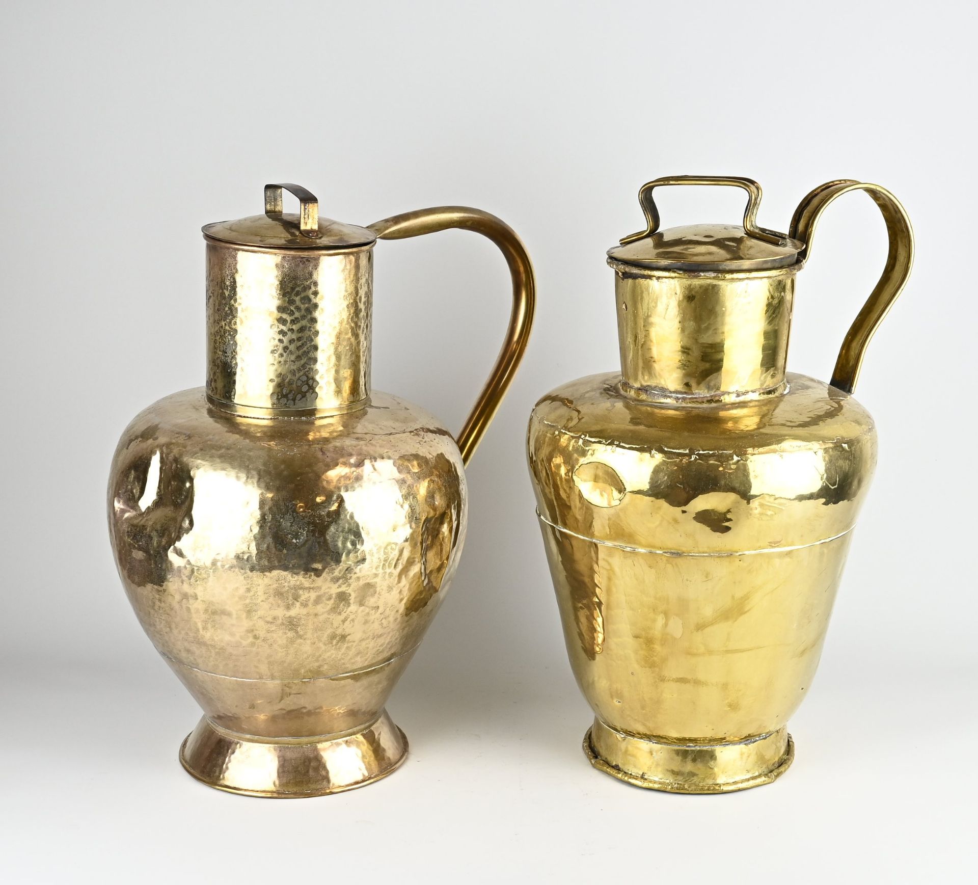 Two antique brass milk jugs, 1900