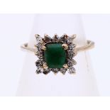 Gold ring with emerald and diamond