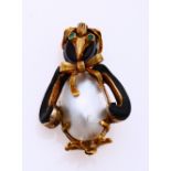 Golden brooch penguin with mother-of-pearl