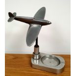 A metal desk ornament with model of a RAF Spitfire, 6.5 inches in height. Spitfire can be rotated.