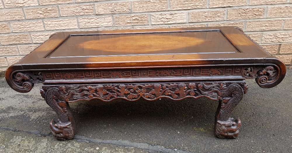 Carved Chinese Coffee Table Decorated with Dragons and Bats measuring 42 inches x 18 inches - Image 2 of 5