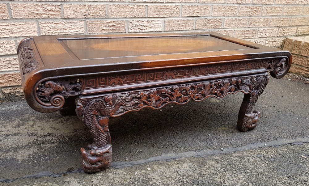 Carved Chinese Coffee Table Decorated with Dragons and Bats measuring 42 inches x 18 inches