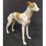 A Ceramic Greyhound or Lurcher Figurine measuring 8 inches in height, no maker marks.