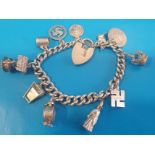 925 Silver Charm Bracelet with various charms weighing 49g