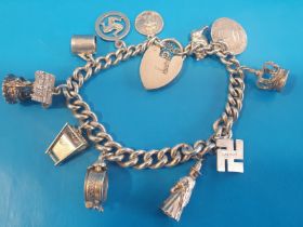 925 Silver Charm Bracelet with various charms weighing 49g