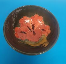 Vintage Hibiscus Moorcroft Footed Bowl with faint impressed maker's mark. Size is 110mm diameter.