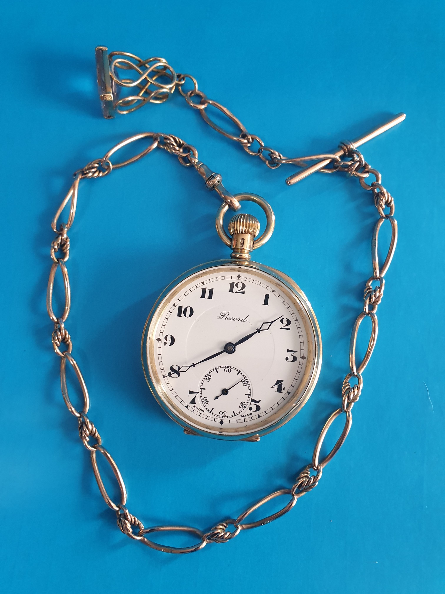 9ct Gold Record Pocket Watch with 9ct Gold Chain and Gemstone. Total weight 117.53g