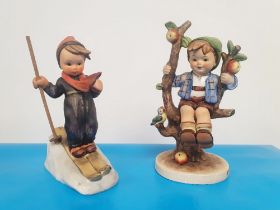 Two Vintage Goebel Figurines - Skier (one pole missing) and Apple Tree Boy