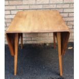 Ercol Rectangular Drop Leaf Table Model Number 383, Extended Table measures 54 inches x 29 inches.