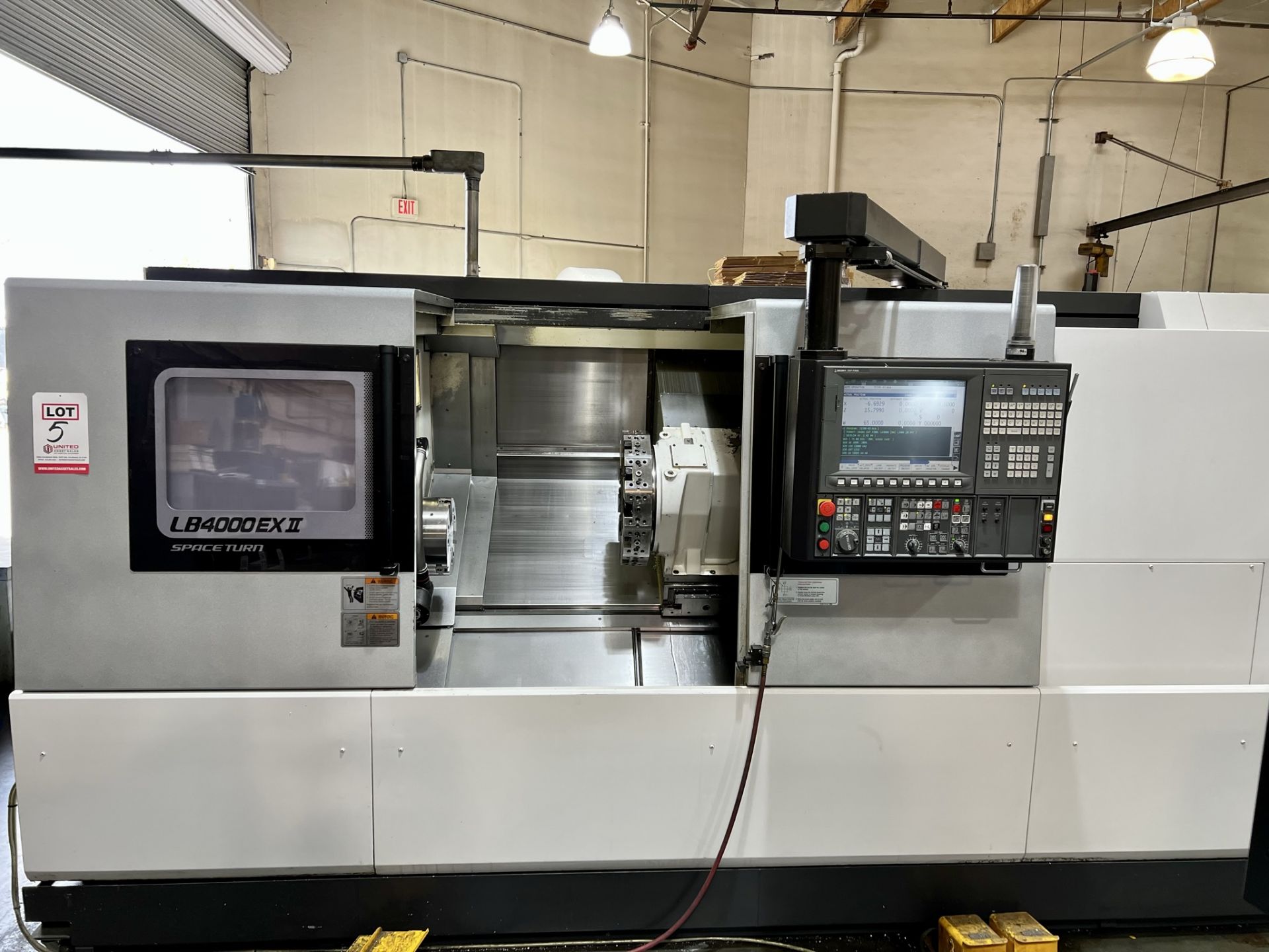 2013 OKUMA LB4000EXII-C1500 TURNING CENTER, OSP-P300L CNC CONTROL, 10" KITAGAWA CHUCK, 2-AXIS