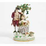 Porcelain ensemble of gardeners with an apple tree