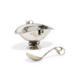 Silver gravy boat and sauce spoon