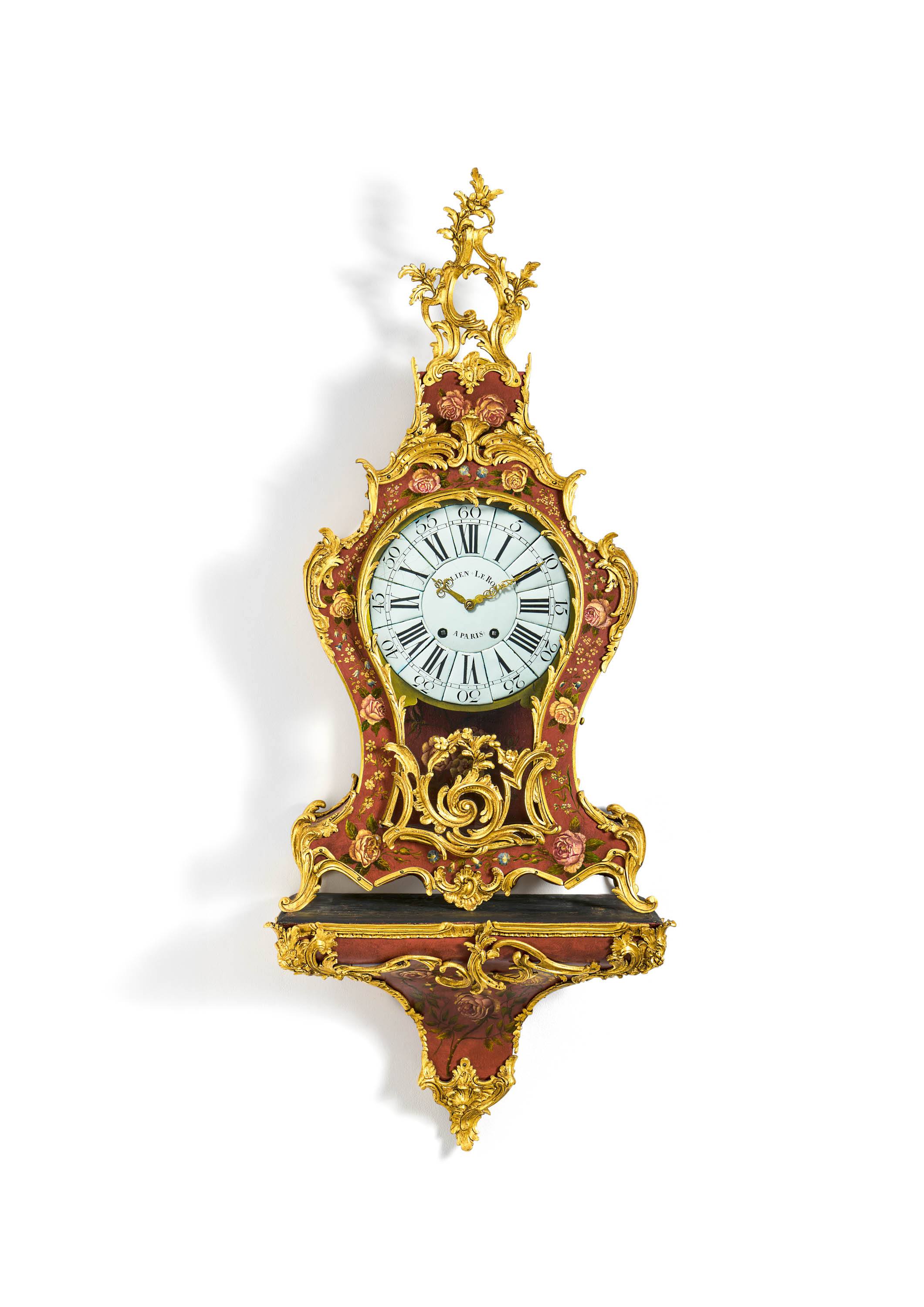 Louis XV pendulum clock on console with floral décor